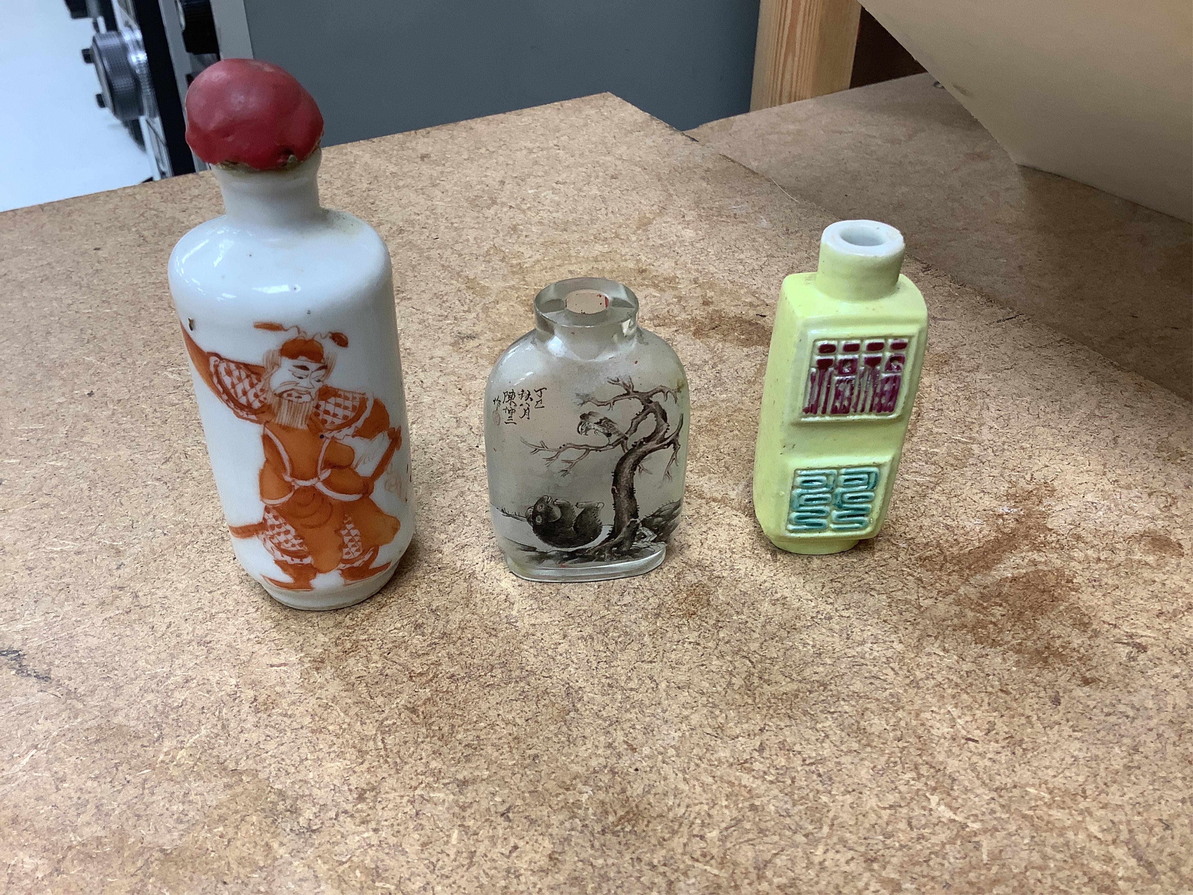 A small collection of Chinese snuff bottles, 19th century and later to include reverse glass painted examples and cinnabar lacquered examples, largest 9.5cm high